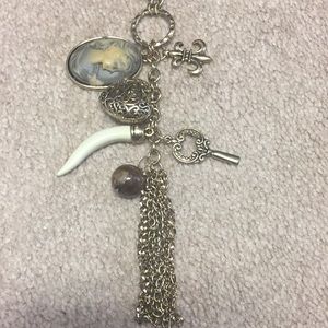 Antiqued gold tassel charm necklace